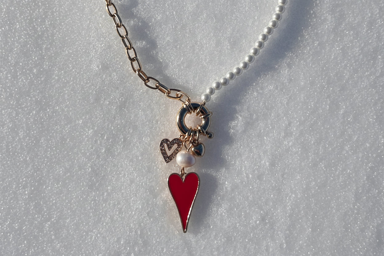Necklace with a red pendant on a gray surface